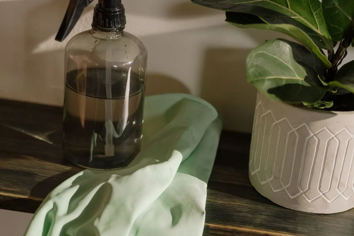 Disinfectant sprayer and protective gloves used for biohazard cleaning