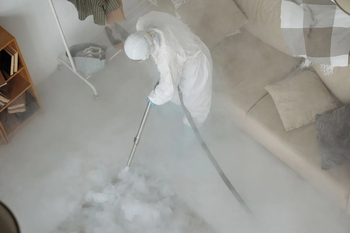 Biohazard cleanup technician in protective equipment, Sneedville, TN